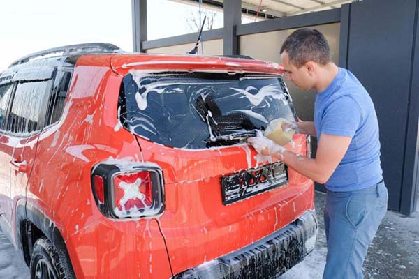 Man Washing Car by Hand