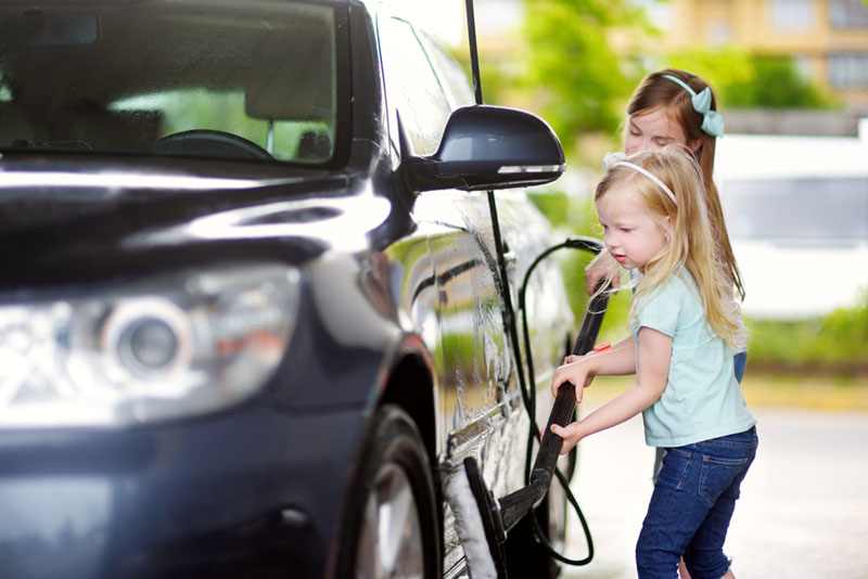 kids-washing-car-at-self-serve-car-wash