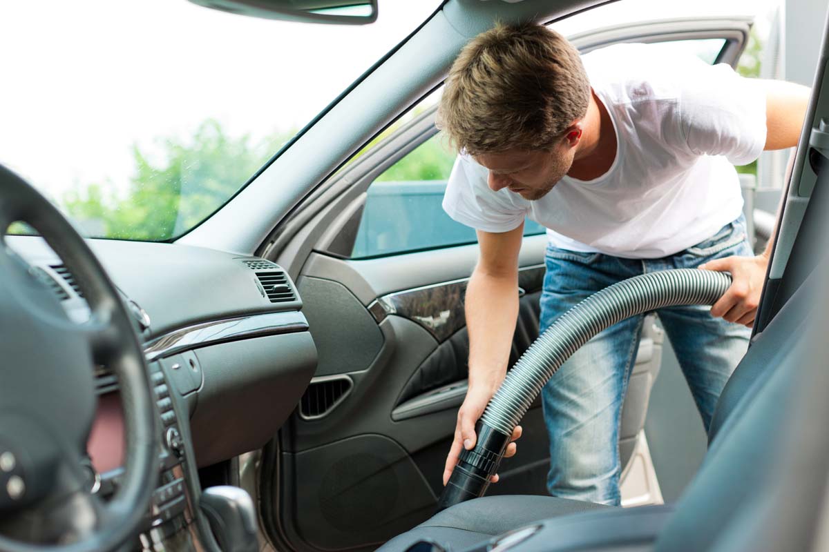 Man Vacuuming car