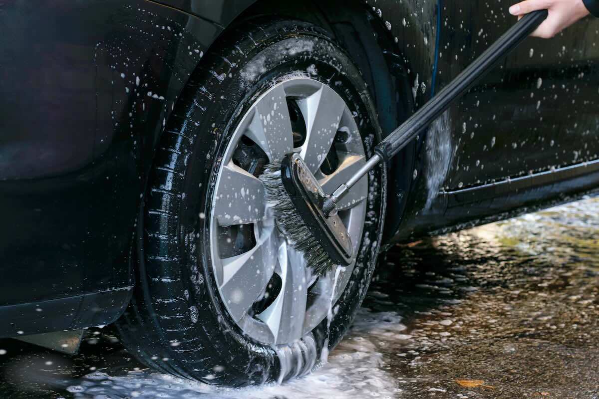 Cleaning wheels at the self service car wash
