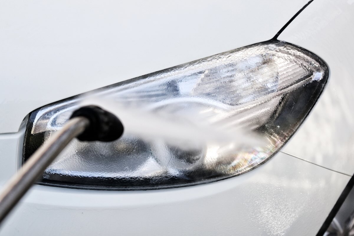 Washing headlights at carwash